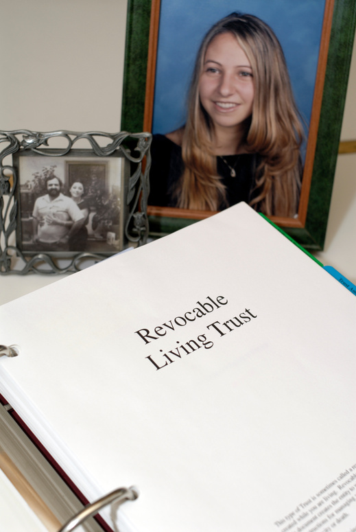 Revocable Living Trust documents with family pictures.